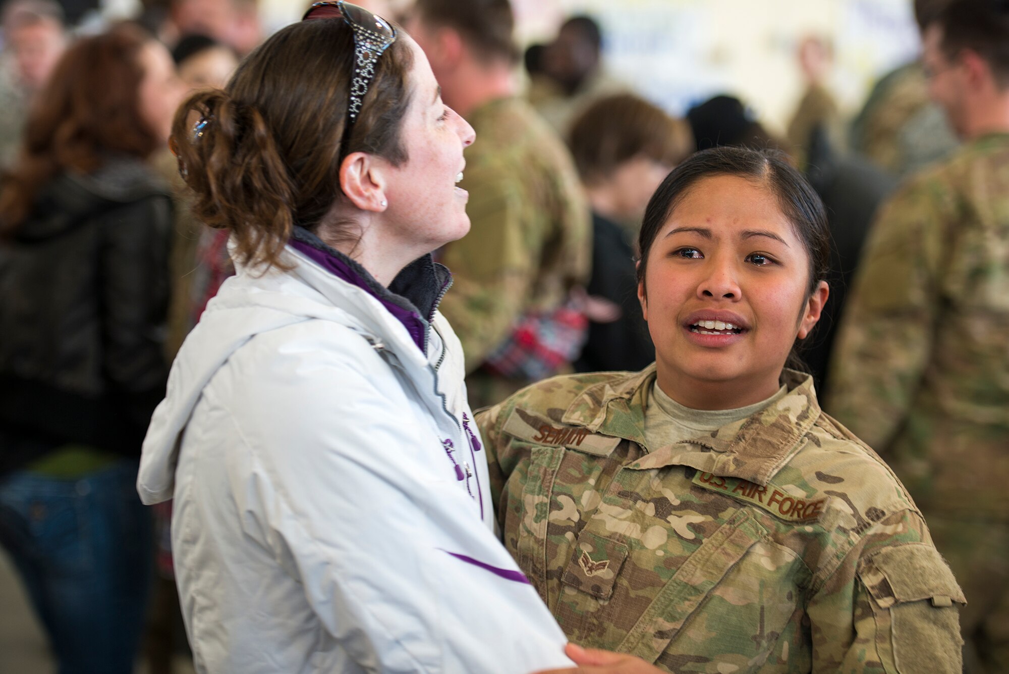 U.S. Air Force Airman 1st Class Mariejoyce Seman, 823d Base Defense Squadron fire team member, gives a hug to a friend after returning home to Moody Air Force Base, Ga., Dec. 16, 2013. Seman was deployed to Bagram Airfield, Afghanistan, for six months. (U.S. Air Force photo by Airman 1st Class Ryan Callaghan/Released)
