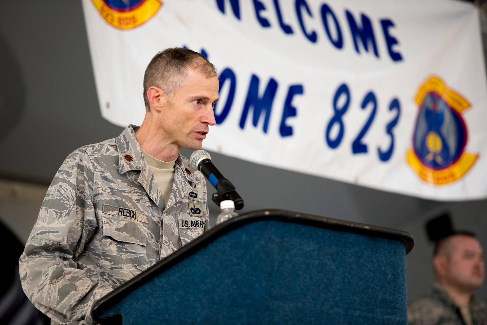 U.S. Air Force Maj. Andrew Resch, 823d Base Defense Squadron commander, speaks to the crowd during a deployment-return ceremony at Moody Air Force Base, Ga., Dec. 16, 2013. Resch commended his troops on their hard work and dedication before dismissing them to reunite with family and friends. (U.S. Air Force photo by Airman 1st Class Ryan Callaghan/Released)
