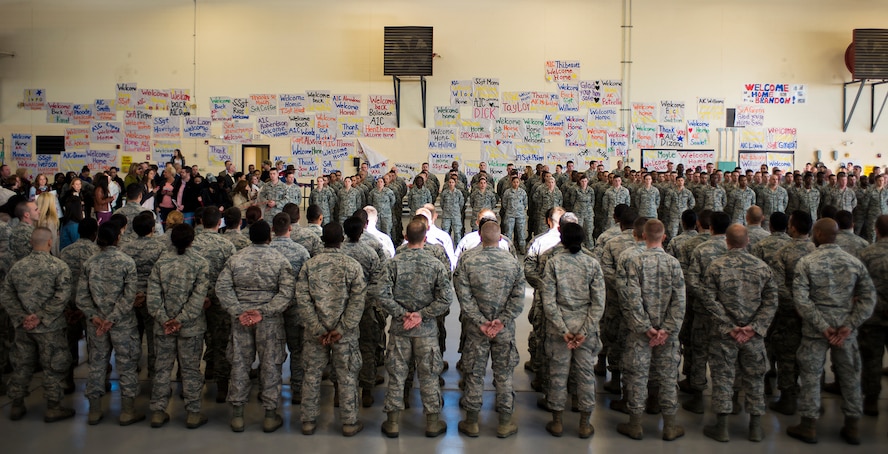 Airmen from the 822nd and 824th Base Defense Squadrons stand in formation as members of the 823d BDS march between them as part of a deployment-return ceremony at Moody Air Force Base, Ga., Dec. 16, 2013. The 823d BDS was augmented by the 105th Security Forces Squadron from Stewart Air National Guard Base, N.Y., during a six-month deployment to Bagram Airfield, Afghanistan. (U.S. Air Force photo by Airman 1st Class Ryan Callaghan/Released)