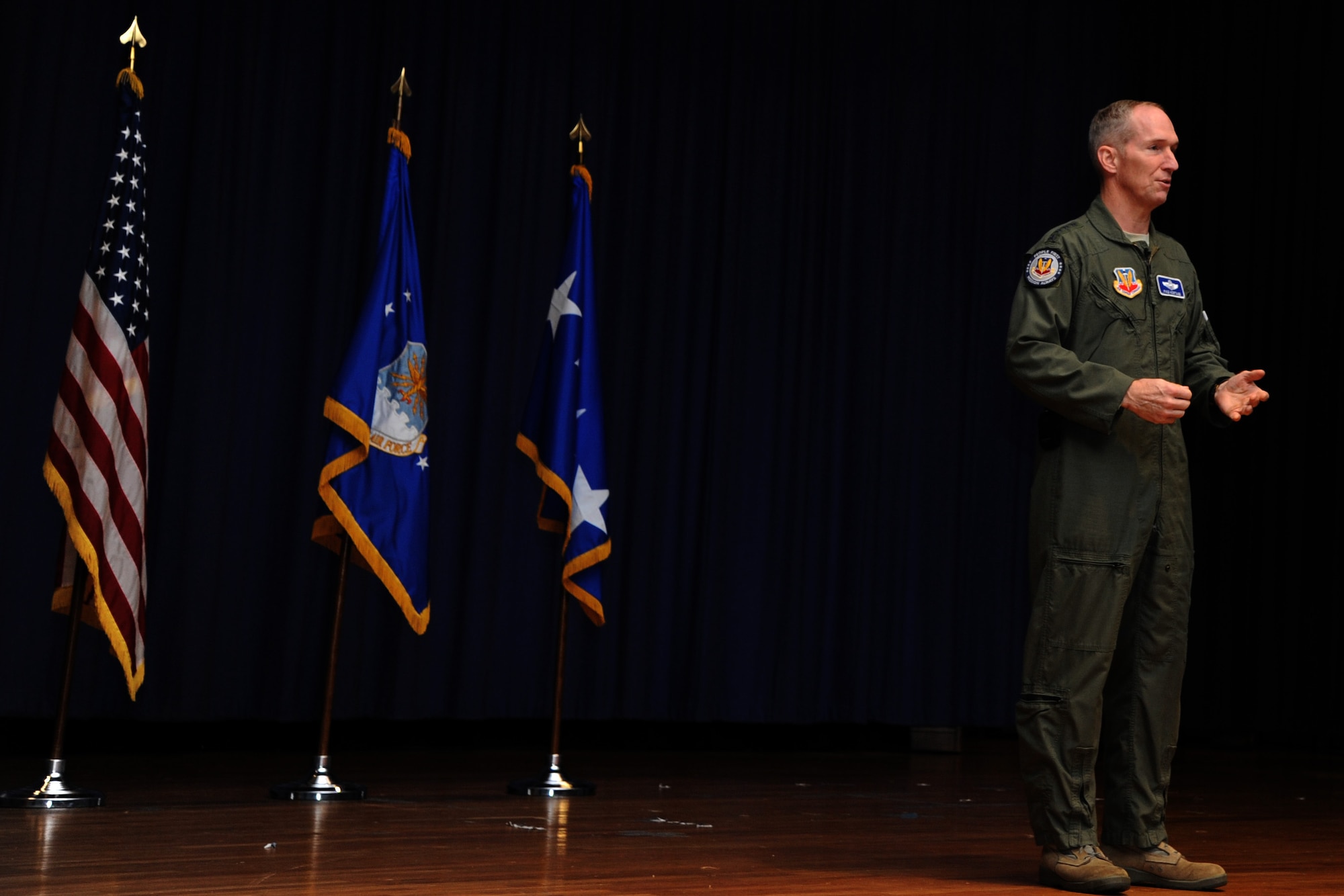 Gen. Mike Hostage, commander of Air Combat Command, spent time with the Airmen of Headquarters ACC during three all-calls at Langley Air Force Base Va., Dec. 12, 2013. Hostage concluded the meeting by thanking the attendees for all the magnificent work they do on the staff and for the wings. (U.S. Air Force photo by Staff Sgt. Candice Page/Released)