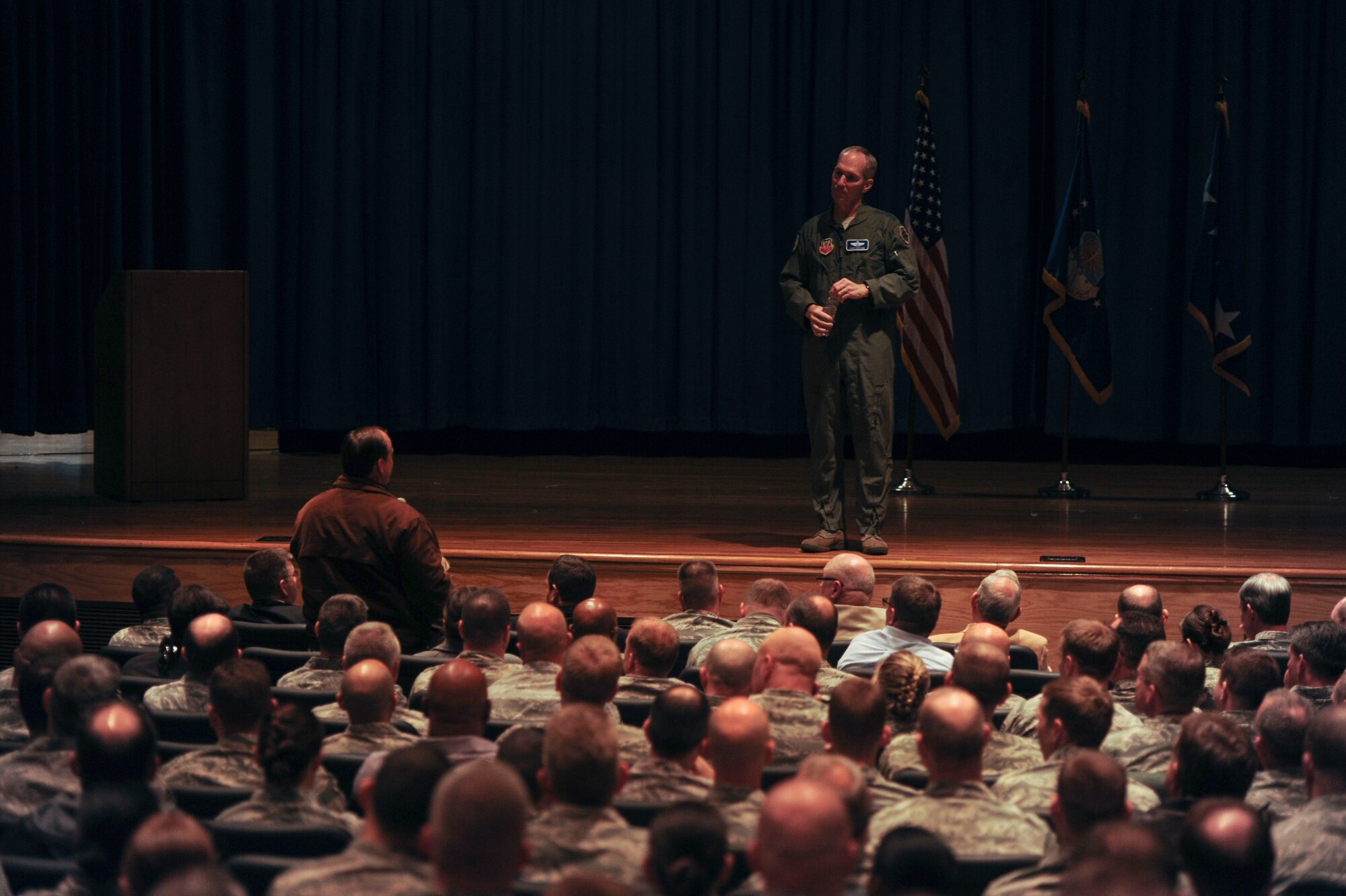 Gen. Mike Hostage, commander of Air Combat Command, opened the floor for questions from Airmen of all ranks and grades, during an all-call at Langley Air Force Base, Va., Dec. 12, 2013. Hostage addressed top issues within the Air Force such as budget, force management programs, sexual assault prevention and safety. (U.S. Air Force photo by Staff Sgt. Steve Stanley/Released)