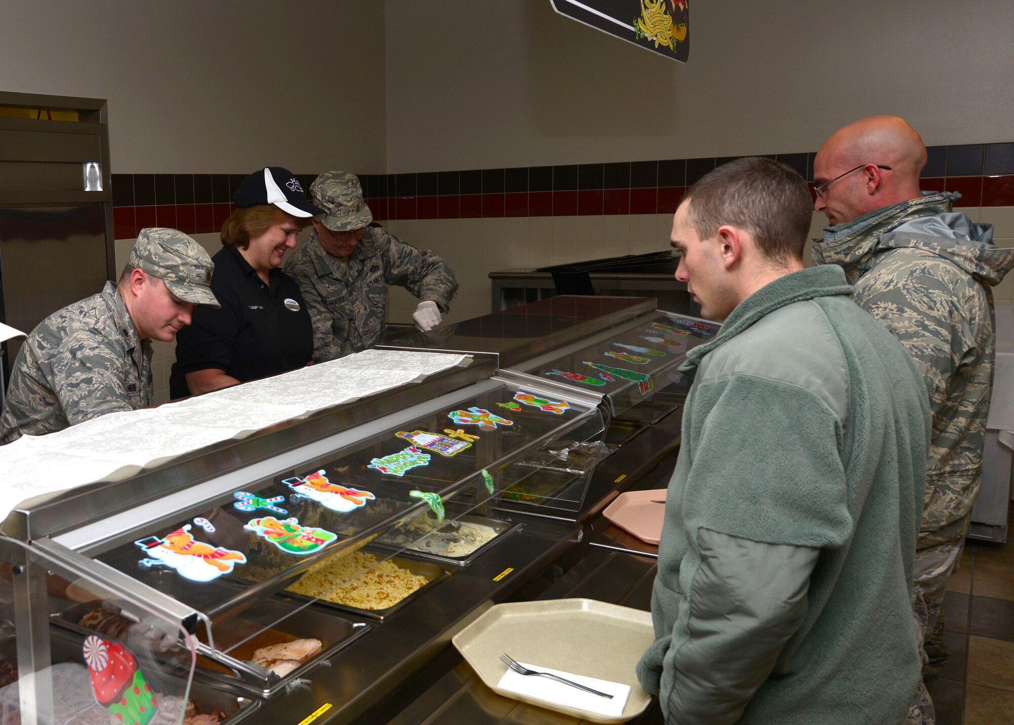 A unit commander serves a holiday meal here at the Niagara Falls Reserve Station during the 914th Airlift Wing Unit Training Assembly December 7, 2013.

Traditionally, during the holiday season, commanders from different squadrons and units in the 914th Airlift Wing serve meals to the Airmen during the UTA troop-feed times. The leadership served 150 pounds of pork and 160 pounds of roast beef and several hundred service members during the UTA at The Niagara Falls Community Activity Center on base where the food was prepared. (U.S. Air Force photo by Tech. Sgt. Joseph McKee)
