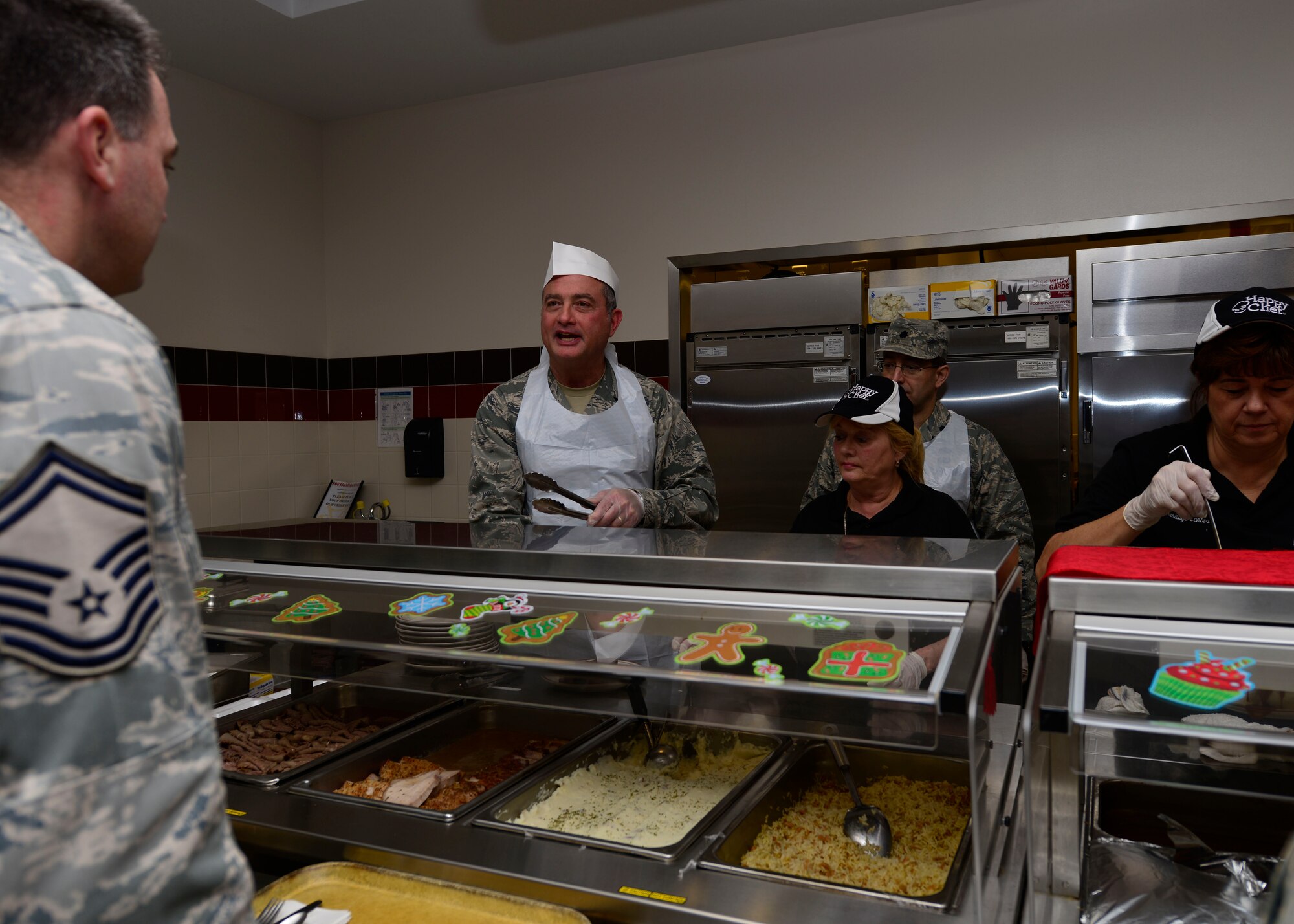 914th Airlift Wing Commander Col. Walter Gordon serves a holiday meal here at the Niagara Falls Reserve Station during the 914th Airlift Wing Unit Training Assembly December 7, 2013.

Traditionally, during the holiday season, commanders from different squadrons and units in the 914th Airlift Wing serve meals to the Airmen during the UTA troop-feed times. The leadership served 150 pounds of pork and 160 pounds of roast beef and several hundred service members during the UTA at The Niagara Falls Community Activity Center on base where the food was prepared. (U.S. Air Force photo by Tech. Sgt. Joseph McKee)
