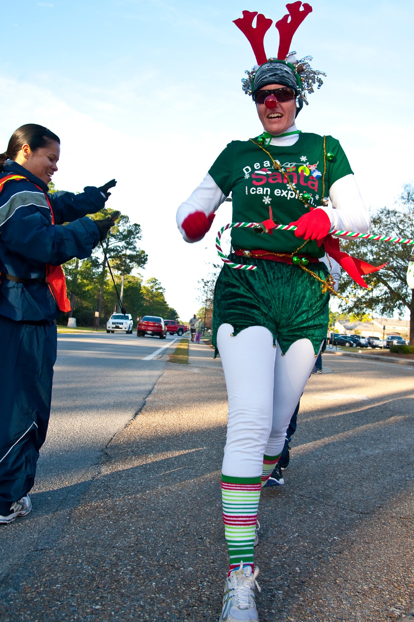Runners raced during the Jingle Bell 5K at Hurlburt Field, Fla., Dec. 13, 2013. The 1st Special Operations Force Support Squadron hosts monthly themed runs on Hurlburt Field. (U.S. Air Force Photo/Senior Airman Michelle Vickers) 