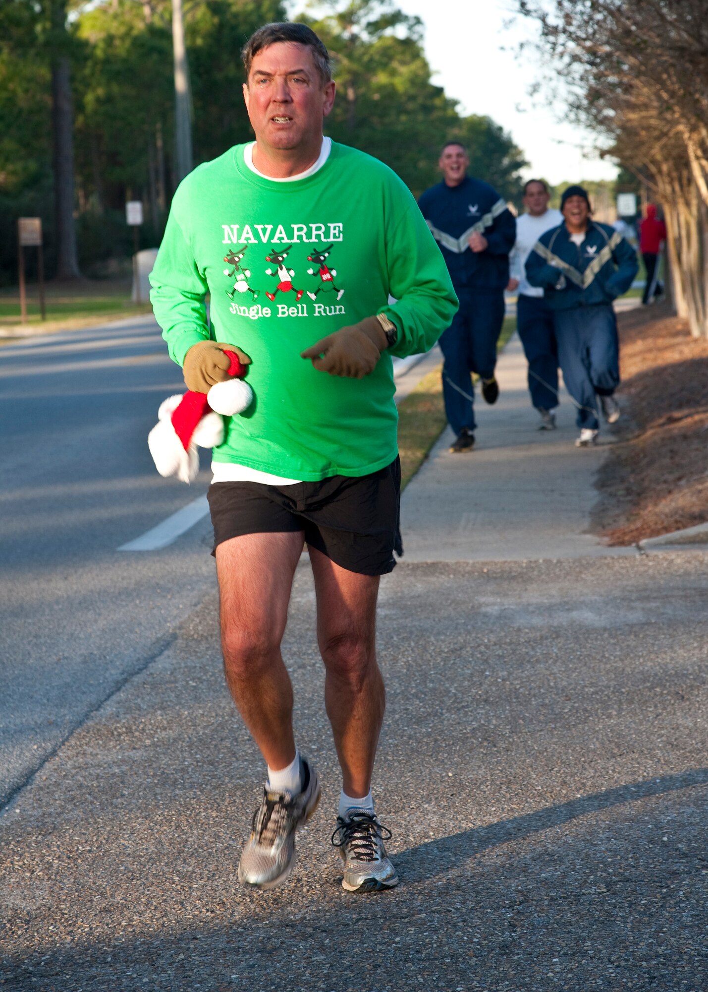 Runners raced during the Jingle Bell 5K at Hurlburt Field, Fla., Dec. 13, 2013. The 1st Special Operations Force Support Squadron hosts monthly themed runs on Hurlburt Field. (U.S. Air Force Photo/Senior Airman Michelle Vickers) 