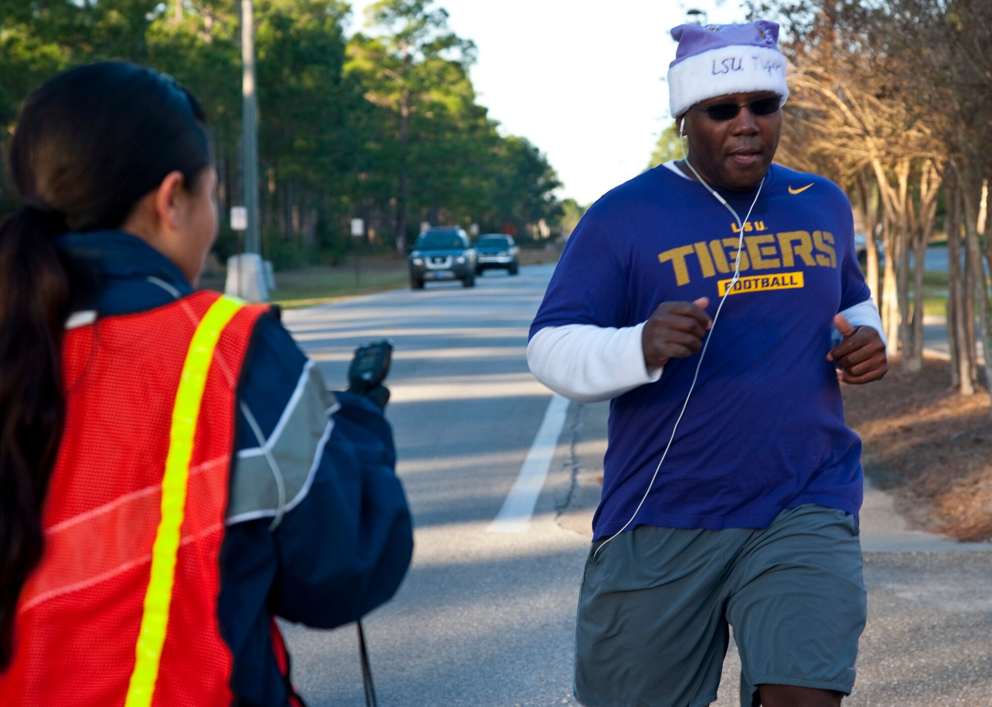 Runners raced during the Jingle Bell 5K at Hurlburt Field, Fla., Dec. 13, 2013. The 1st Special Operations Force Support Squadron hosts monthly themed runs on Hurlburt Field. (U.S. Air Force Photo/Senior Airman Michelle Vickers) 