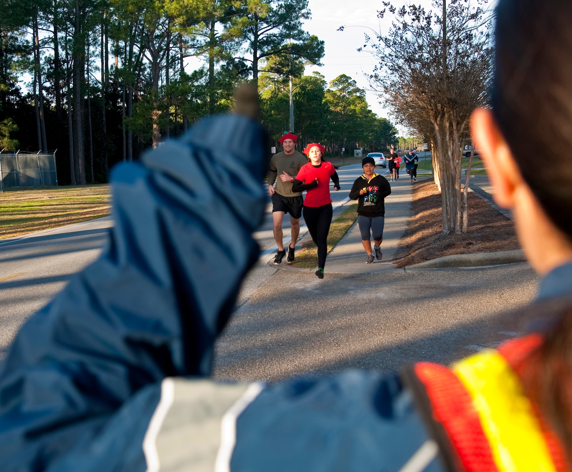 Runners raced during the Jingle Bell 5K at Hurlburt Field, Fla., Dec. 13, 2013. The 1st Special Operations Force Support Squadron hosts monthly themed runs on Hurlburt Field. (U.S. Air Force Photo/Senior Airman Michelle Vickers) 