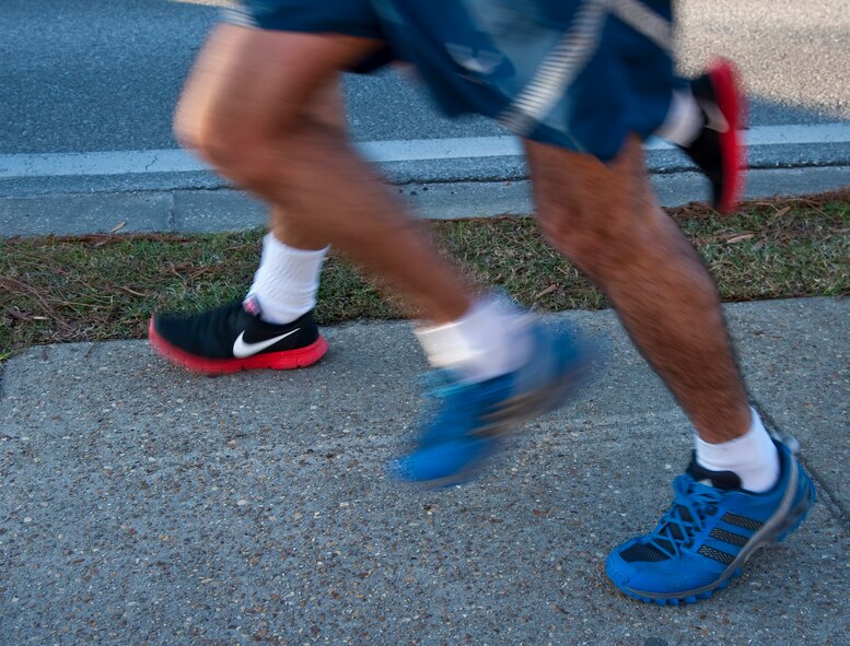 Runners raced during the Jingle Bell 5K at Hurlburt Field, Fla., Dec. 13, 2013. The 1st Special Operations Force Support Squadron hosts monthly themed runs on Hurlburt Field. (U.S. Air Force Photo/Senior Airman Michelle Vickers) 