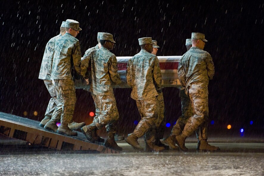 A U.S. Air Force carry team transfers the remains of Air Force Senior Airman Mark A. Forester, of Tuscaloosa, Ala., at Dover Air Force Base, Del., Sept. 30, 2010. Forester was assigned to the 21st Special Tactics Squadron, Pope Air Force Base, N.C. (U.S. Air Force photo/Roland Balik)