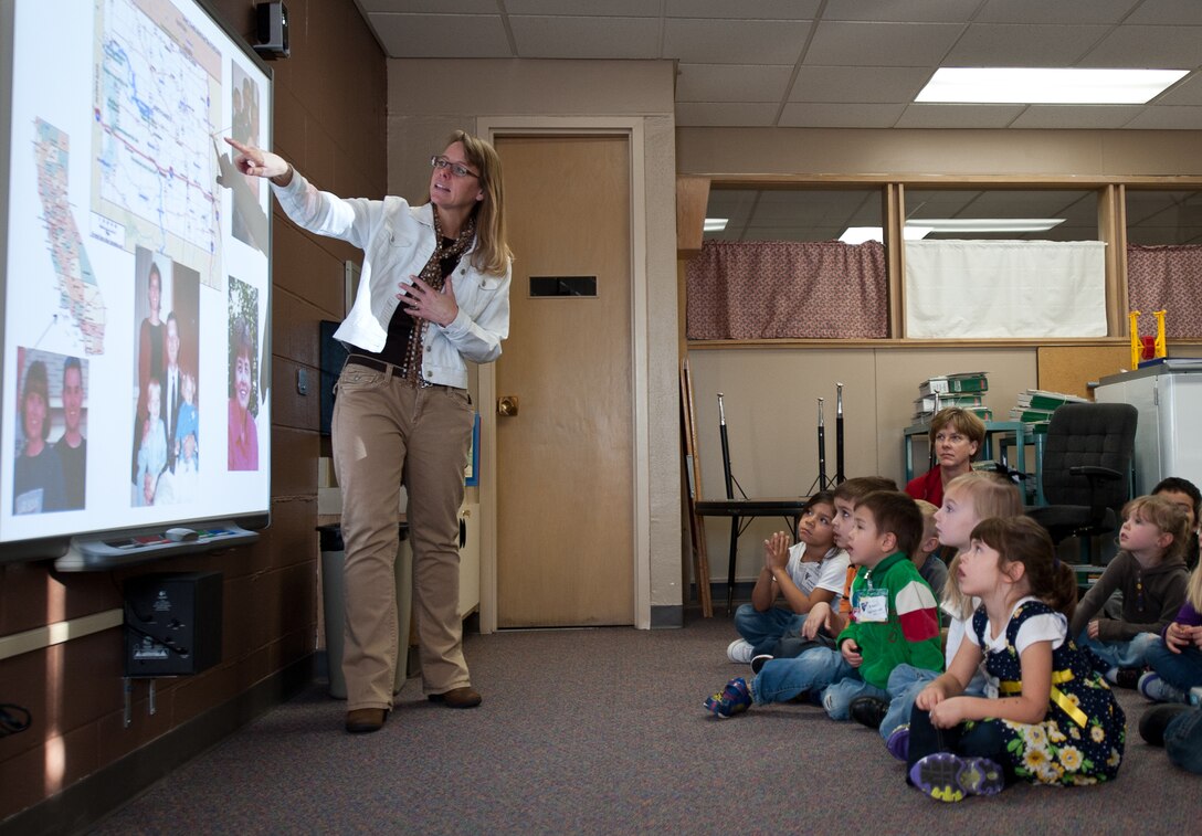 Brenda Ehrmantraut, children’s book author, introduces herself to students in Badger Clark Elementary School at Box Elder, S.D., Dec. 12, 2013. Ehrmantraut visited BCES to read her book Night Catch, a story about the trials military families undergo when their loved ones deploy. (U.S. Air Force photo by  Senior Airman Alystria Maurer/Released)