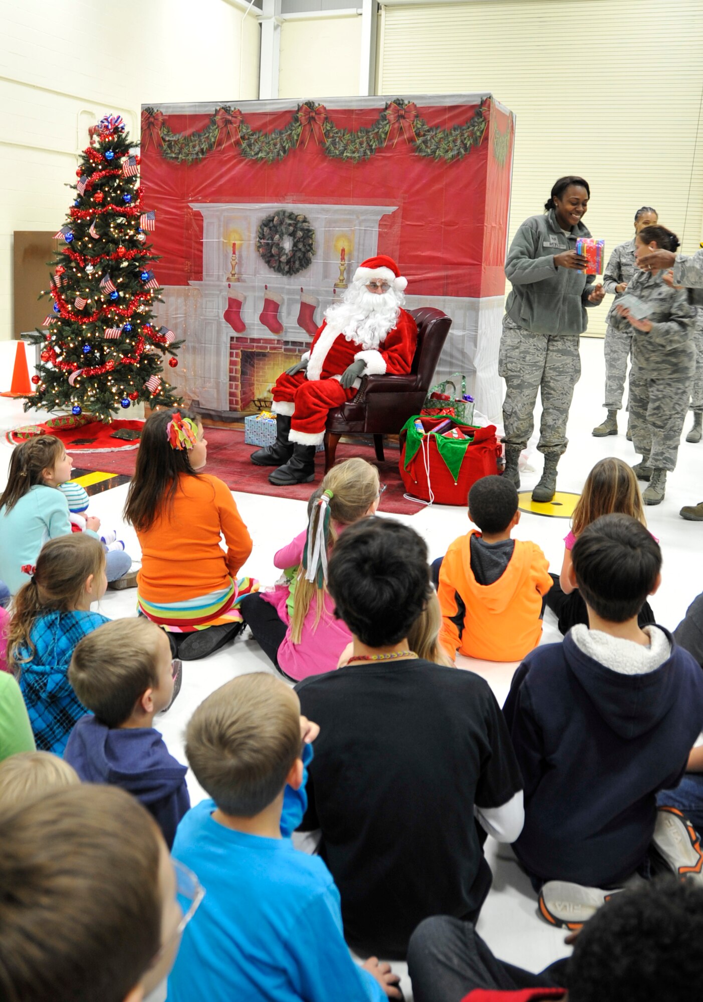 Santa Claus visited the 403rd Wing, an Air Force Reserve unit, during the Wing's Christmas Party at the Maintenance Fuel Cell from 11:30 a.m. to 1:30 p.m. Dec. 7, 2013.  The event featured crafts and activities for children as well as a free lunch. (U.S. Air Force photo/Master Sgt. Jessica Kendziorek)
