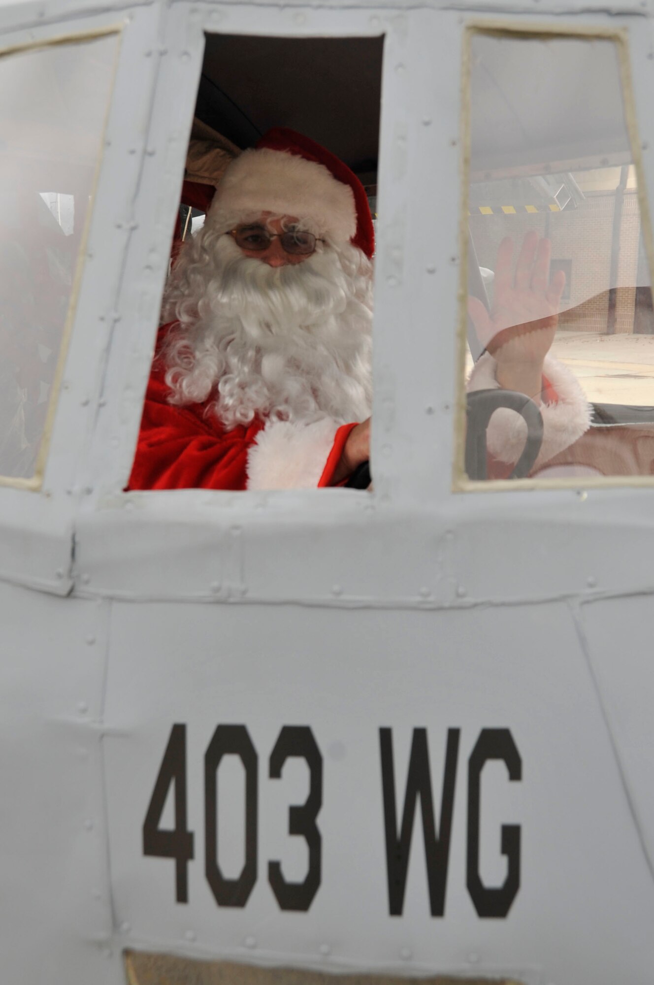 Santa Claus visited the 403rd Wing, an Air Force Reserve unit, during the Wing's Christmas Party at the Maintenance Fuel Cell from 11:30 a.m. to 1:30 p.m. Dec. 7, 2013.  The event featured crafts and activities for children as well as a free lunch. (U.S. Air Force photo/Master Sgt. Jessica Kendziorek)
