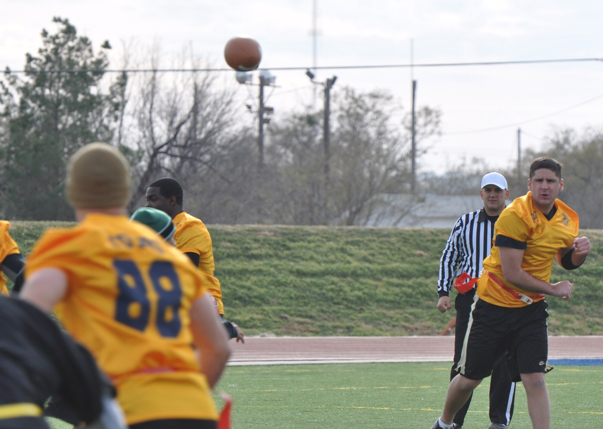 GOODFELLOW AIR FORCE BASE, Texas – The Navy quarterback passes the ball downfield during the Army-Navy flag football game at the Mathis Fitness Center football field Dec. 11. Despite Navy efforts to continuously move the ball down field, they were only able to score one touchdown during the match. (U.S. Air Force photo/ Airman 1st Class Erica Rodriguez)
