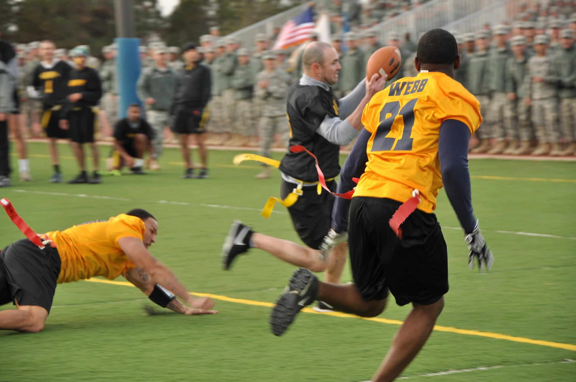 GOODFELLOW AIR FORCE BASE, Texas – Chris McCallum, Army quarterback, runs a play in for a touchdown during the Army-Navy flag football game at the Mathis Fitness Center football field Dec. 11. The play was called back on account of a holding penalty against the Army. (U.S. Air Force photo/ Senior Airman Joshua Edwards)
