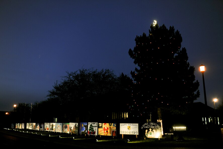 RAF ALCONBURY, United Kingdom – The RAF Alconbury Christmas Tree and Holiday Cards from squadrons around RAF Alconbury and RAF Molesworth were lit Dec. 7 during a tree lighting ceremony. The tree lighting was held in front of the RAF Alconbury Chapel. (U.S. Air Force photo by Staff Sgt. Brian Stives)