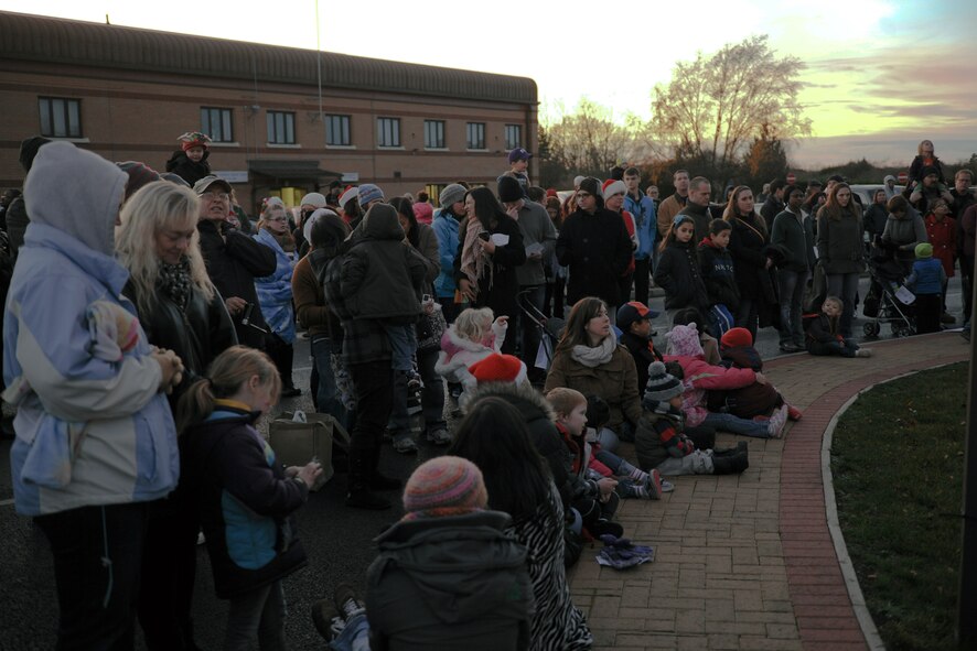 RAF ALCONBURY, United Kingdom – Members of RAF Alconbury and RAF Molesworth gather for the bases tree lighting ceremony Dec. 7. The tree lighting was held in front of the RAF Alconbury Chapel. (U.S. Air Force photo by Staff Sgt. Brian Stives)