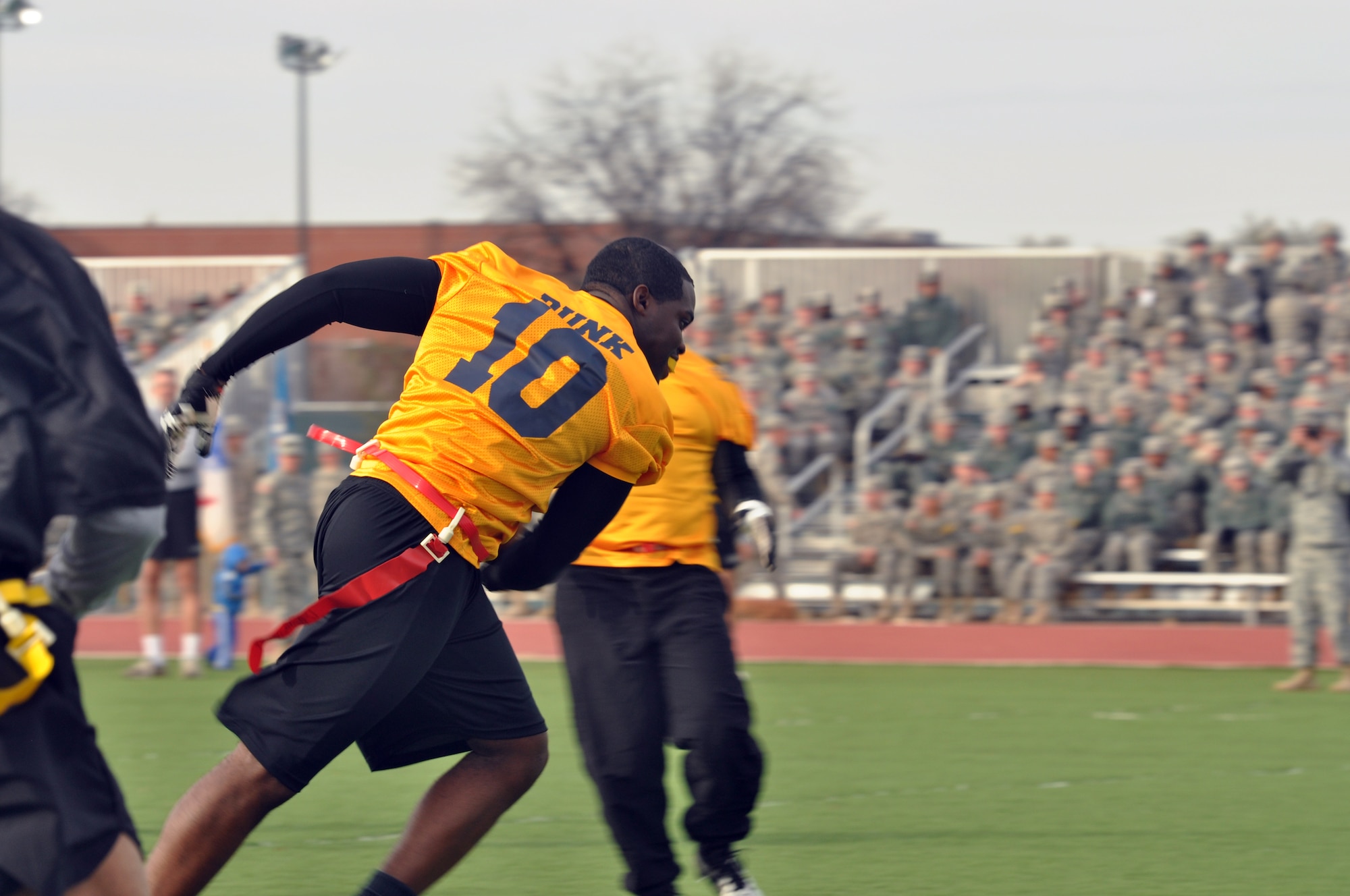 GOODFELLOW AIR FORCE BASE, Texas – Jerome Dunkley, Navy Center for Information Dominance Detachment running back, runs downfield during the Army-Navy flag football game at the Mathis Fitness Center football field Dec. 11. Dunkley broke two tackles, before breaking away. (U.S. Air Force photo/ Senior Airman Joshua Edwards)