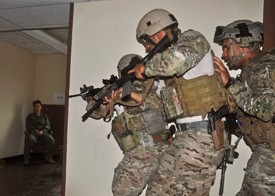 Members of the 919th Special Operations Security Forces Squadron move in to free an Airman held captive during a simulated hostage rescue scenario at Duke Field, Fla., Dec. 9. The scenario was part of the 919th Special Operations Wing's annual Employer Appreciation Day, an event held to educate civilian employers of Duke Field reservists on the wing's wartime mission and to thank them for their support. (U.S. Air Force photo/Dan Neely)