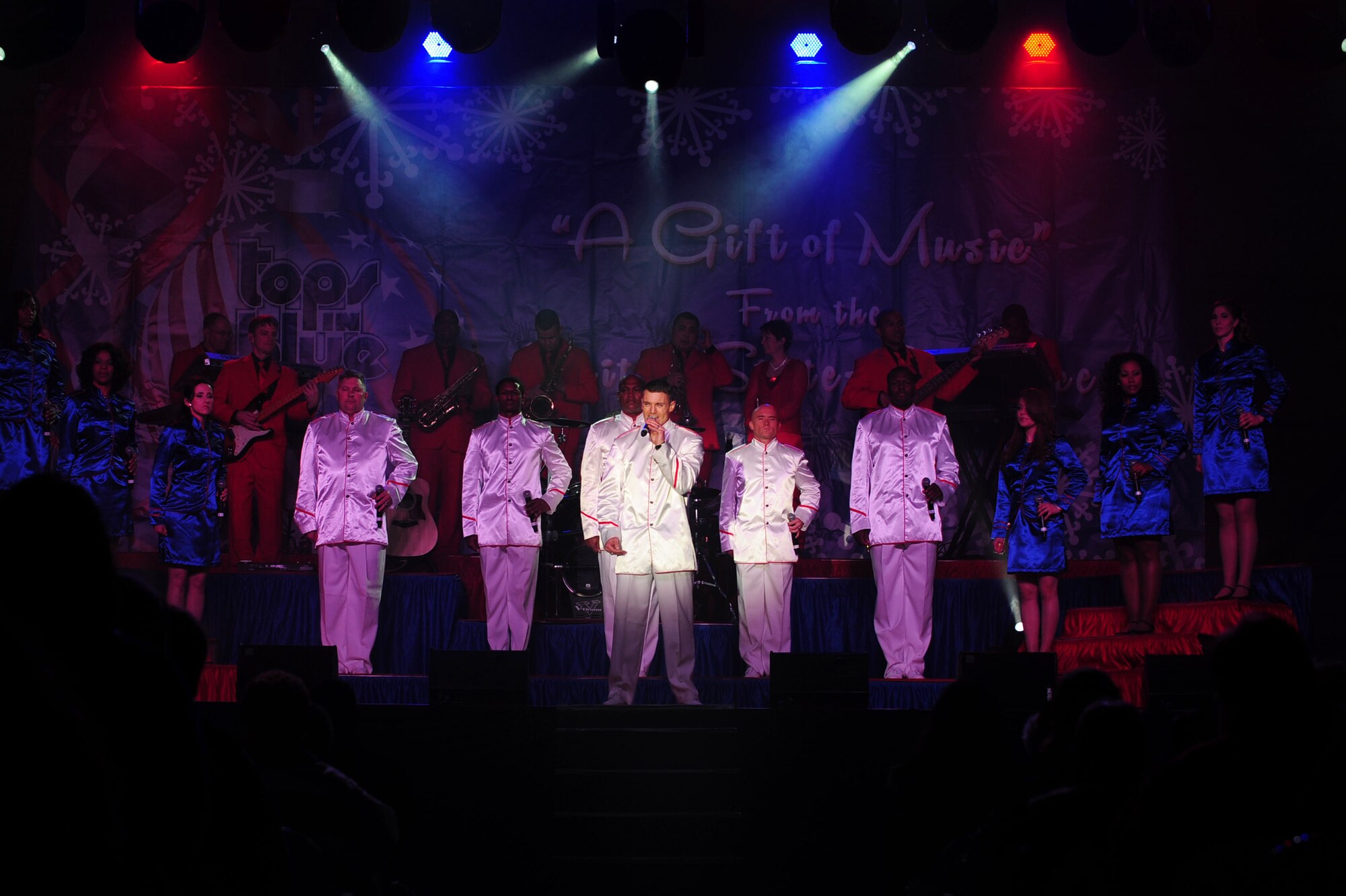 Tops in Blue performers hold a concert Dec. 14, 2013, at Incirlik Air Base, Turkey.  The musical group performed a variety of music including Christmas tunes to bring some holiday spirit to Airmen away from home.  (U.S. Air Force photo by Airmen 1st Class Nicole Sikorski/Released) 