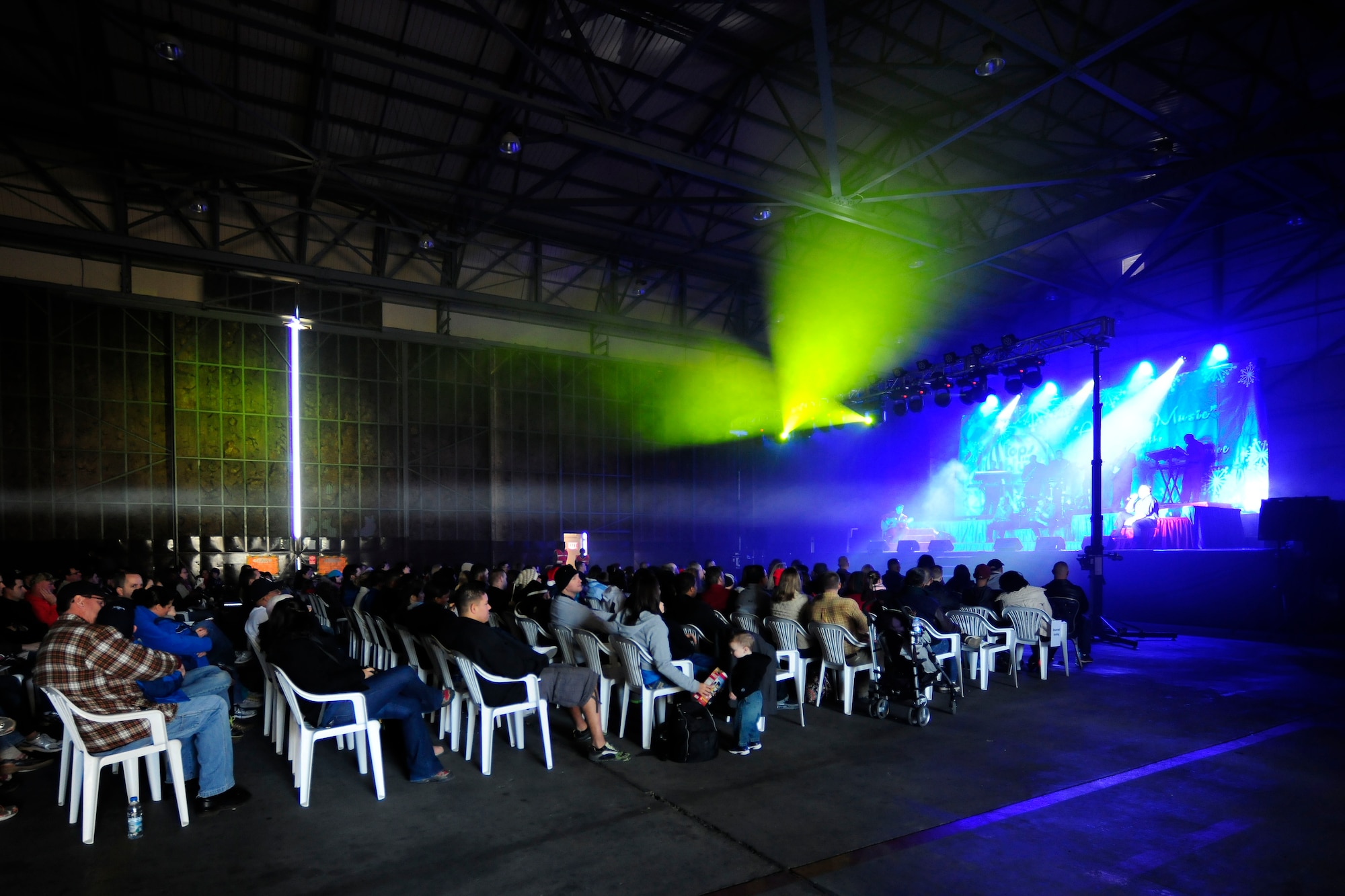 Tops in Blue performers perform a concert Dec. 14, 2013, at Incirlik Air Base, Turkey. The traveling musical group brought "The Gift of Music" to service members and families at Incirlik AB, which consisted of a variety of music from different genres such as country, rock, pop and many others from a mix of generations.  (U.S. Air Force photo by Airman 1st Class Nicole Sikorski) 