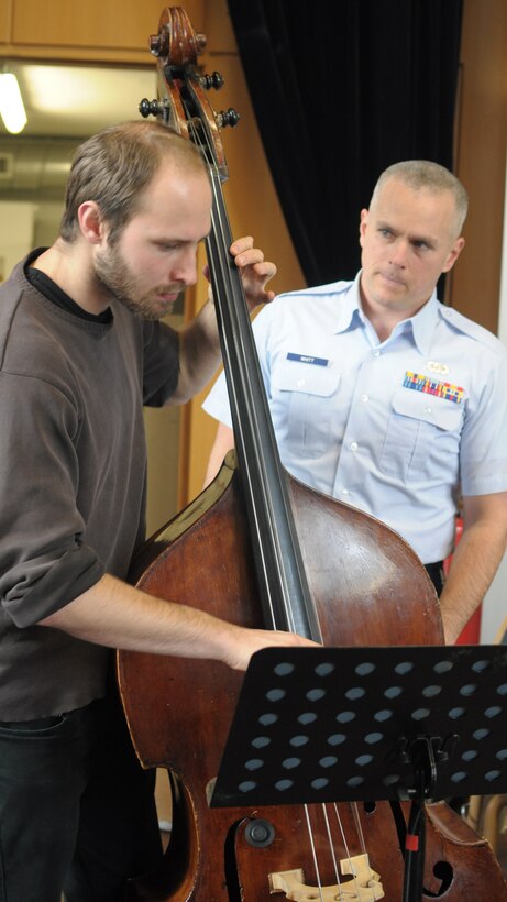 Thhe USAFE Band Ambassadors Jazz Ensemble conduct a masterclass for students of the Kaiserslautern University Big Band.  SSgt Joe Whitt coaches a student bassist on a Latin Jazz piece.
