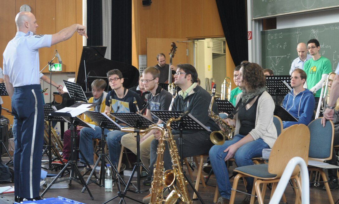 The USAFE Band Ambassadors Jazz Ensemble conduct a masterclass for students of the Kaiserslautern University Big Band.  SSgt Ken Jones works with the band on specific nuances of ensemble playing. 