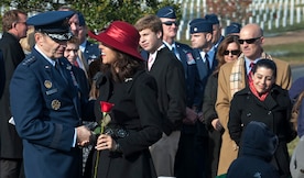 Gen. Robin Rand, Air Education and Training Command commander, speaks with Ginger Gilbert Ravella, after her late husband???s, Maj. Troy Gilbert, remembrance funeral at Arlington Cemetery, Dec. 11, 2013. Gilbert was at one time an executive officer for Rand and had flown with him in the past.  (U.S. Air Force photo by Staff Sgt. Carlin Leslie)