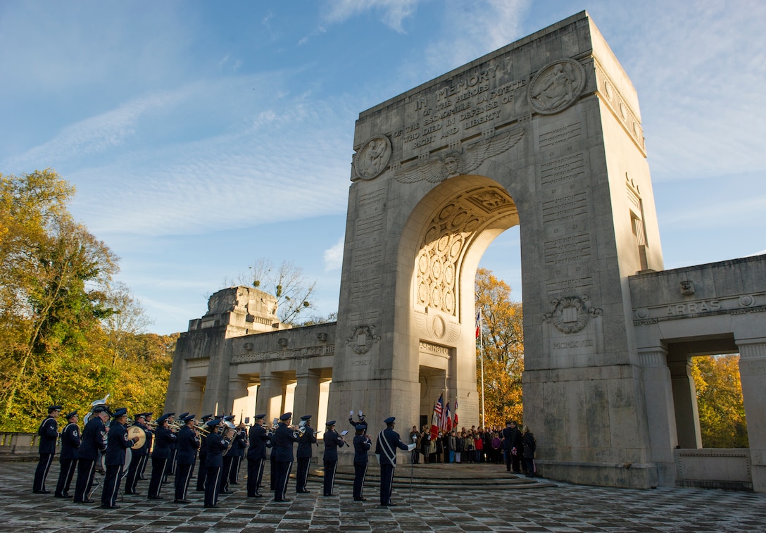 The USAFE Marching Band performs for a Veteran's Day ceremony at the Lafayette Escadrille Memorial in Marnes-la-Coquette, France.  The Madam Mayor of Marnes-la-Coquette reflected on the significance of the American and French aviators of the Lafayette Escadrille when she stated, "peace, unity freedom only exist at the cost of eternal vigilance.  Therefore, we must vever forget the tragic events that shook the world 100 years ago."