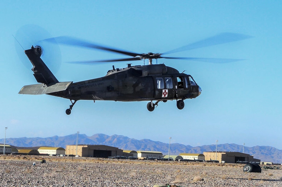 A U.S. Army UH-60 Black Hawk helicopter lifts off on a medical evacuation support mission from Shindand Air Base, Afghanistan, Dec. 8, 2013.