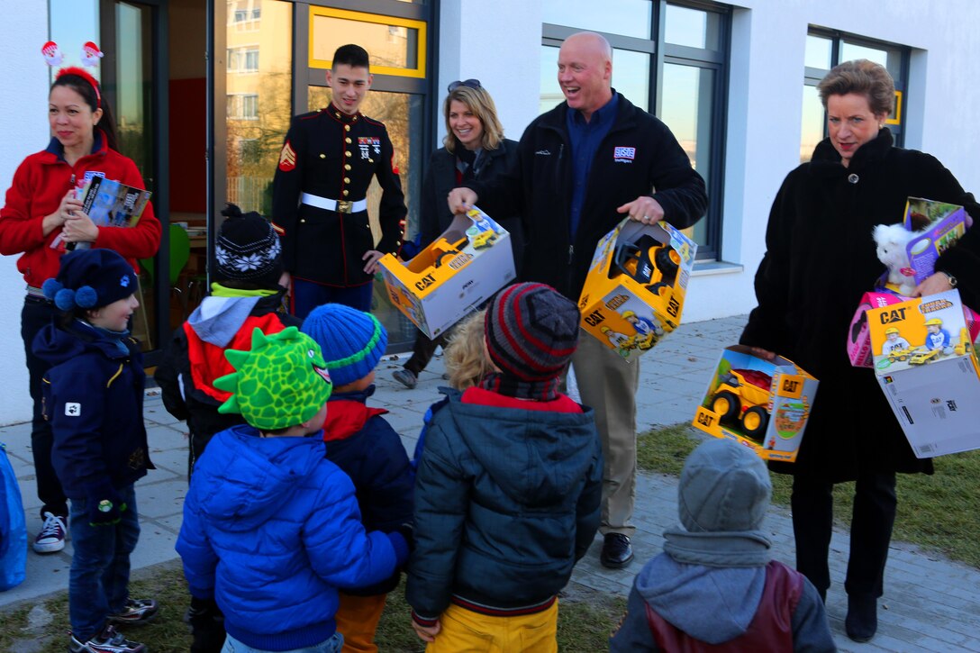 With coordination with the Toys for Tots program in Landstuhl, Germany, volunteers from U.S. Marine Corps Forces Europe and Africa, their Family Readiness Office, and USO-Stuttgart, delivered donated toys to children throughout the Stuttgart community, Dec. 16. The Family Readiness Office collected more than 250 donated toys from the USAG Stuttgart community during the holiday season for the delivery that visited kindergartens and schools from Boblingen into downtown, with the final delivery at the Rathaus, Stuttgart.