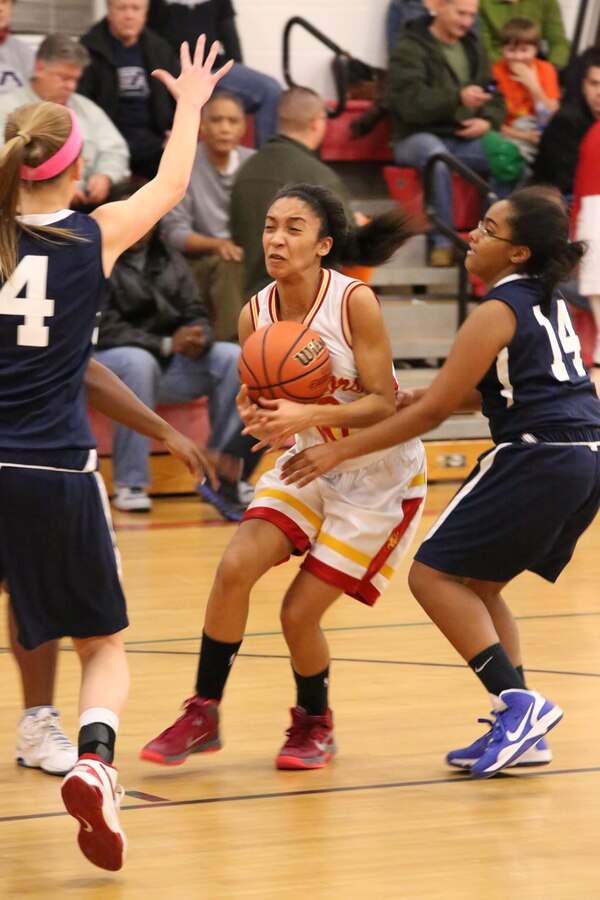 Marquis, guard, struggles to hold onto the ball while looking for a teammate during a varsity basketball game against the Fredericksburg Academy Falcons on Dec. 11, 2013. The Warriors lost to the Falcons 39-18. 