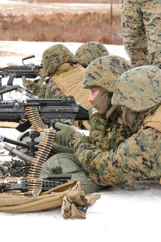 Marines from the Finance Section of Combat Development Command fire M249 Squad Automatic Weapons at Range 14 on Dec. 11, 2013. Over two dozen Marines participated in the exercise.