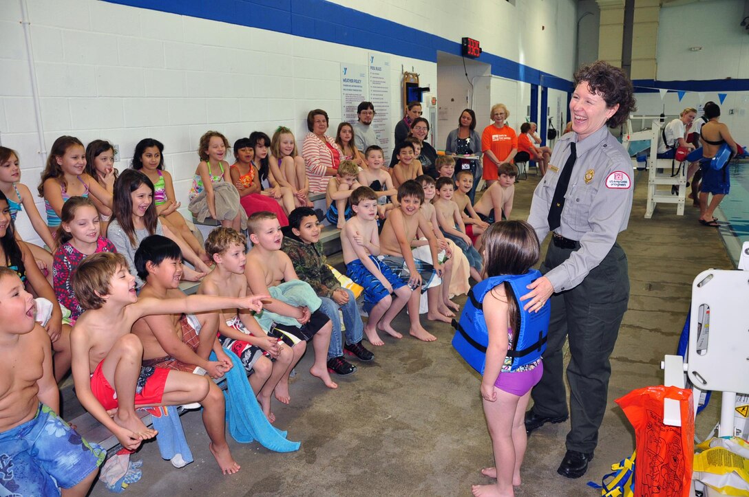 U.S. Army Corps of Engineers Park Ranger Sondra Carmen instructs youth today about lfe jackets and the importance of water safety as part of the Learn to Swim Program at the Putnam County Family YMCA in Cookeville, Tenn. (photos by Mark Rankin) 