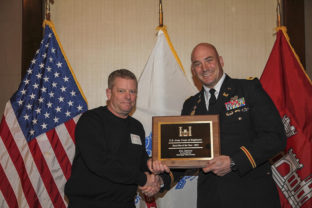 The U.S. Army Corps of Engineers’ Headquarters in Washington, D.C., announced its selection of Corps’ St. Paul District employee and Winona, Minn., resident Eric Johnson as the recipient of its Construction Hard Hat of the Year Award. Here, he receives his award from the district commander, Col. Dan Koprowski.