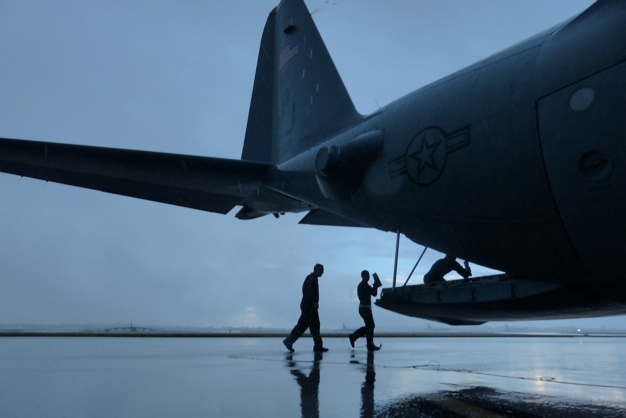 Members of the 374th Airlift Wing, Yokota Air Base, Japan, prepare for an airdrop mission during Operation Christmas Drop at Andersen Air Force Base, Guam, Dec. 15, 2013. This year marks the 62nd year of Operation Christmas Drop, which began in 1952, making it the world's longest running airdrop mission. Every December, C-130 Hercules crews from the 374th Airlift Wing at Yokota Air Base, Japan, partner with the 36th Wing at Andersen Air Force Base, Guam, to airlift food, supplies and toys to islanders throughout Micronesia. (U.S. Air Force photo by 2nd Lt. Jake Bailey/Released)
