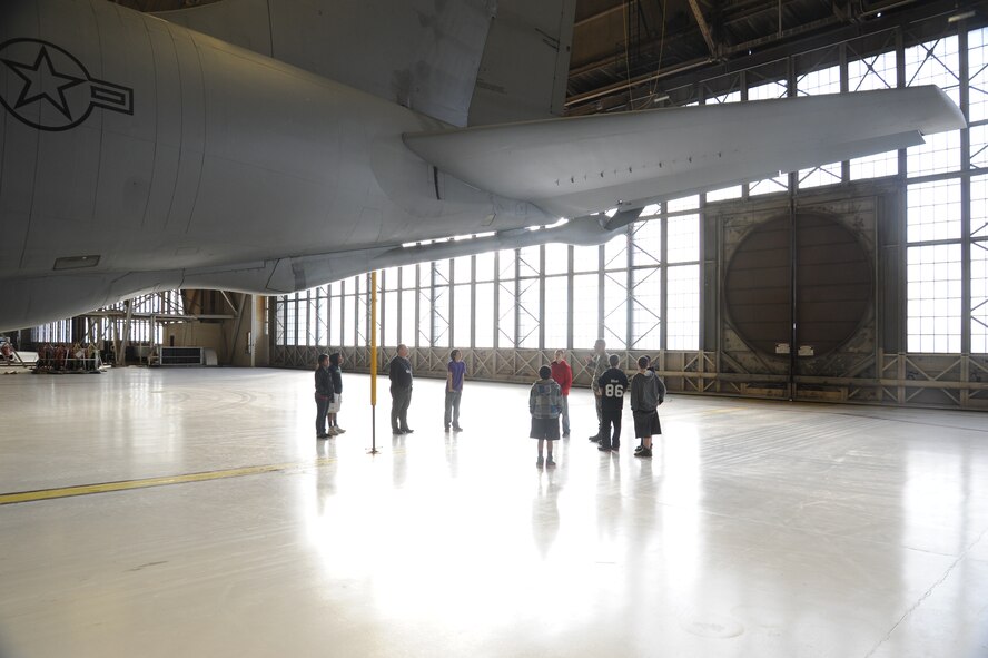 Senior Airman Jordan Allison, 92nd Aircraft Maintenance Squadron aerospace maintenance journeyman, shows Garry Middle School students an aspect of a KC-135 aircraft at Fairchild Air Force Base, Wash., Dec. 17, 2013.  The students toured one of the aircraft to learn more about the base.  (U.S. Air Force photo by Airman 1st Class Sam Fogleman/Released)