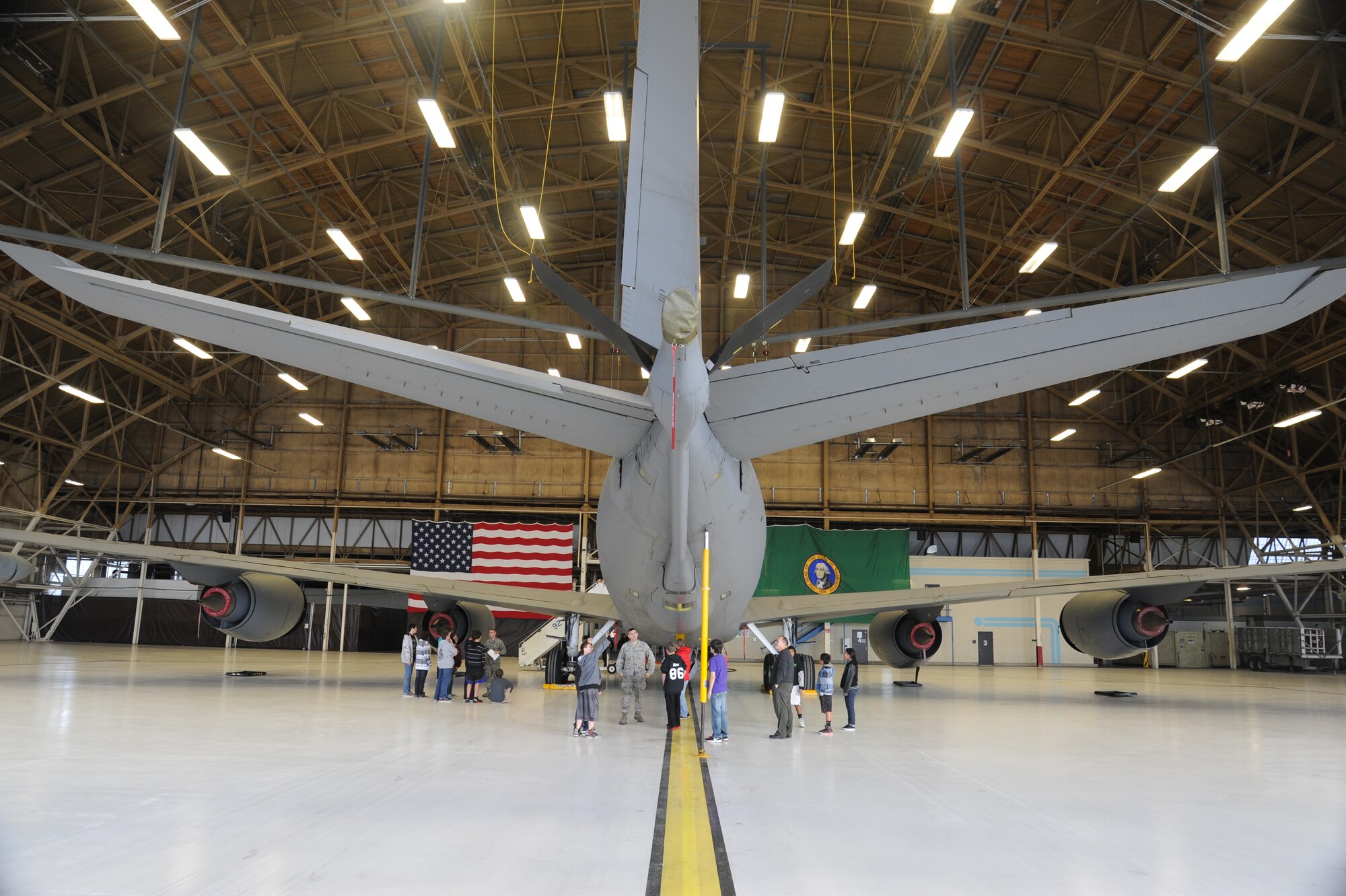 Airmen from the 92nd Aircraft Maintenance Squadron show Garry Middle School students and teachers a KC-135 aircraft static display at Fairchild Air Force Base, Wash., Dec. 17, 2013.  The students toured parts of the base to learn more about their local community.  (U.S. Air Force photo by Airman 1st Class Sam Fogleman/Released)