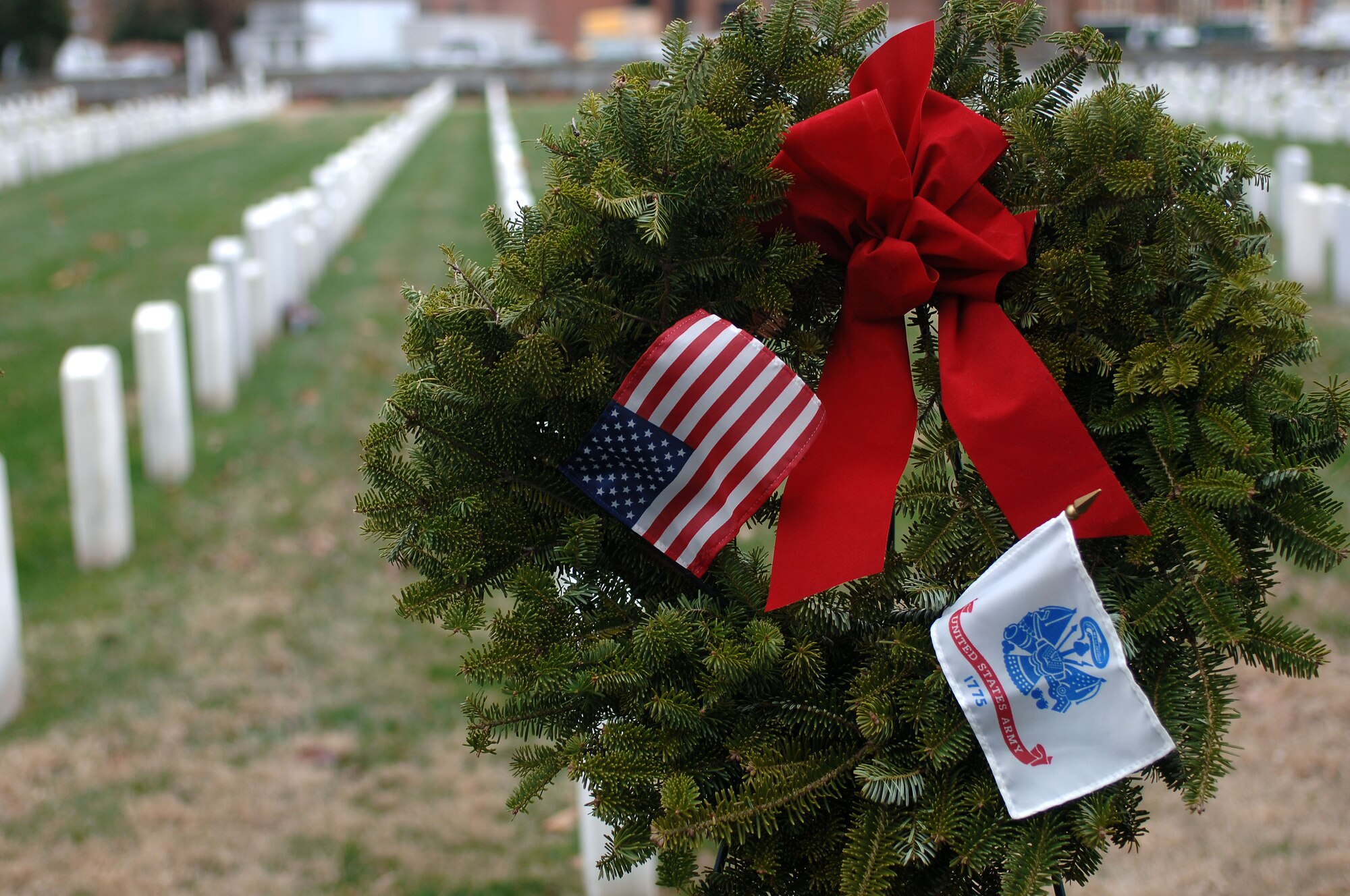 Volunteers laid holiday wreaths on the grave sites of Service members during the “Wreaths Across America” program at the Hampton National Veteran Cemetery in Hampton, Va., Dec. 14, 2013. Military personnel and members of the local community laid more than 7,000 wreaths at national veteran cemeteries in Hampton Roads. (U.S. Air Force photo by Senior Airman Teresa Aber/Released)