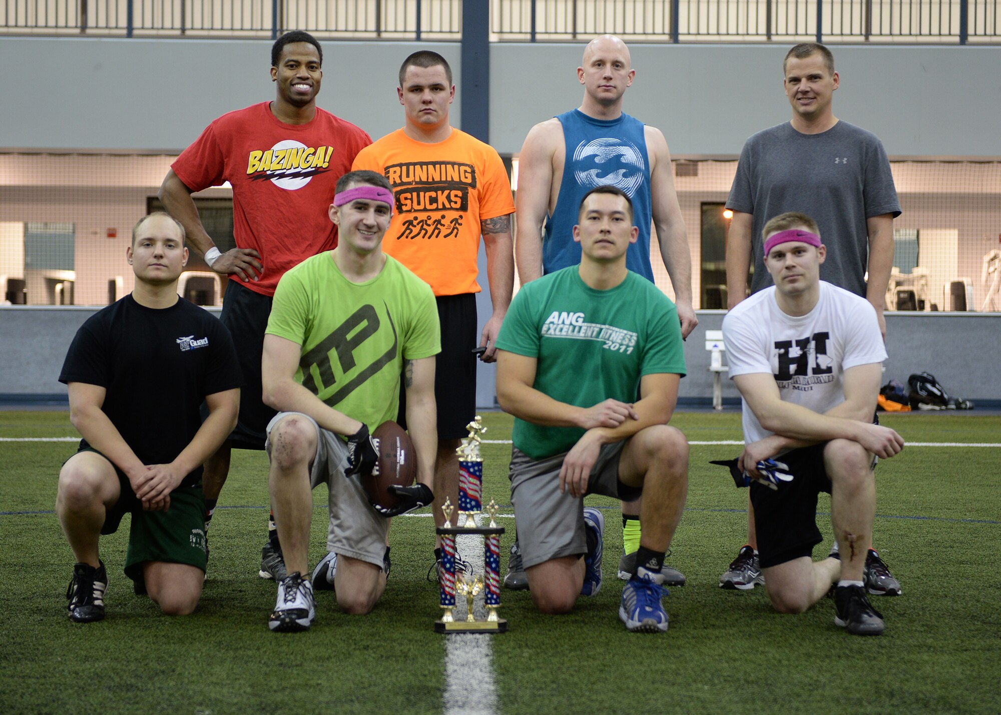 The 168th Air Refueling Wing intramural football team poses with their trophy after a double win during the championship games against the 354th Maintenance Squadron Dec. 16, 2013, Eielson Air Force Base, Alaska. (U.S. Air Force photo by Senior Airman Shawn Nickel/Released)