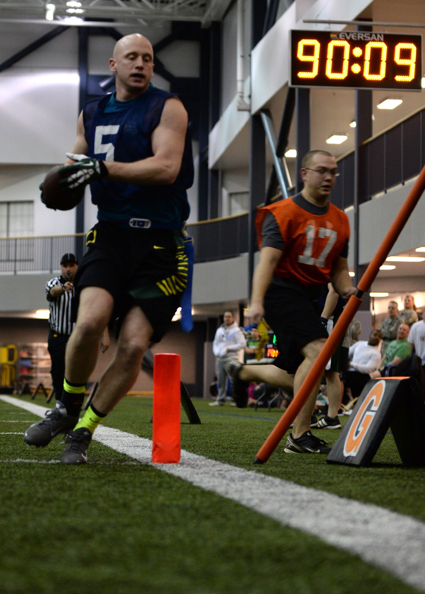 Tech. Sgt. Sean Finney, 168th Air Refueling Wing receiver, runs in for a touchdown during the intramural football championship Dec. 16, 2013, Eielson Air Force Base, Alaska. The team won the game 26-6 against the 354th Maintenance Squadron. (U.S. Air Force photo by Senior Airman Shawn Nickel/Released)