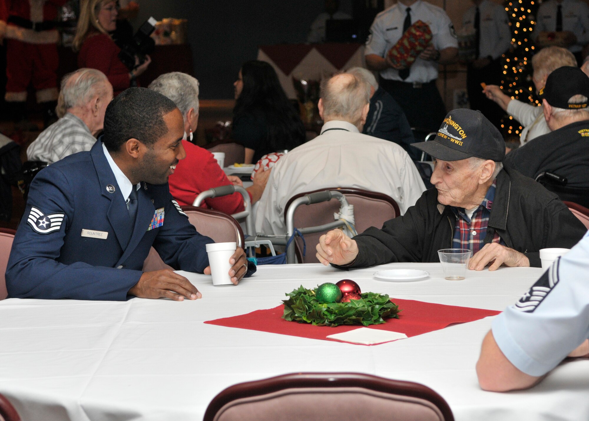 The Tyndall Chief’s Association hosted the 27th Annual Golden Age holiday party for 135 local senior citizens from Bay County Council of Aging and the Sims Veterans home as well as local senior citizens at the Horizons Community Center Ballroom Dec. 17 at Tyndall Air Force Base. Airmen volunteers served cake, cookies and helped to pass out gifts to attendees. (U.S. Air Force photo by Staff Sgt. Javier Cruz)