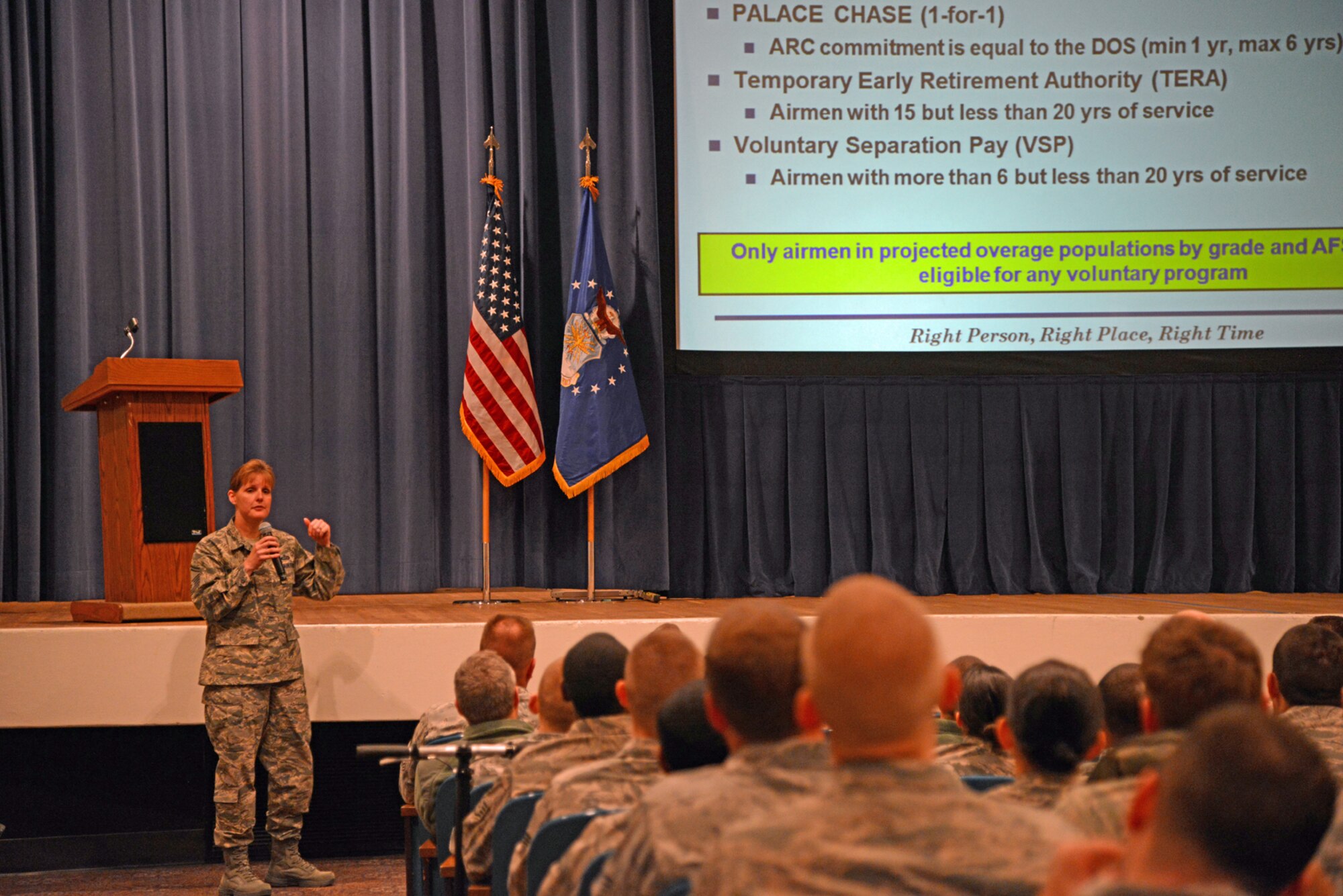 PETERSON AIR FORCE BASE, Colo. – Senior Master Sgt. Kristi Wilson, 21st Force Support Squadron, explains various force management programs during an enlisted call Dec. 17 at the base auditorium. Wilson highlighted the voluntary and involuntary programs available for Airmen in overmanned career fields, or who meet specific conditions for each program as the force prepares to shrink by January 2015. In addition to the enlisted call, Col. John Shaw, 21st Space Wing commander, and personnel experts hosted an officer call on Dec. 17, and a civilian call Dec. 18 to explain officer and civilian force management programs. (U.S. Air Force photo/Tech. Sgt. Jared Marquis)