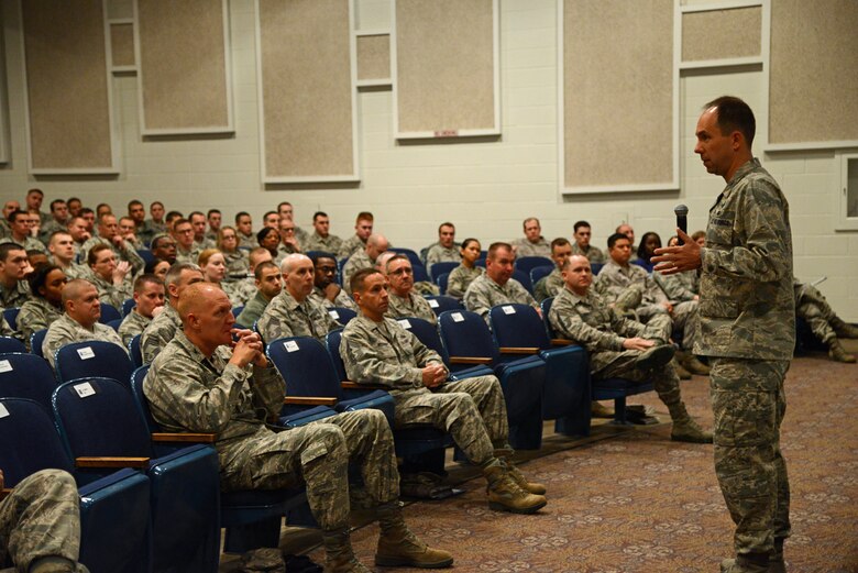 PETERSON AIR FORCE BASE, Colo. – Col. John Shaw, 21st Space Wing commander, explains the need for various force management programs during an enlisted call Dec. 17 at the auditorium. Shaw stressed the need for transparency from Air Force leadership at all levels as the force prepares to get smaller by January 2015. In addition to the enlisted call, Shaw and personnel experts hosted an officer call on Dec. 17, and a civilian call Dec. 18 to explain officer and civilian force management programs. (U.S. Air Force photo/Tech. Sgt. Jared Marquis)