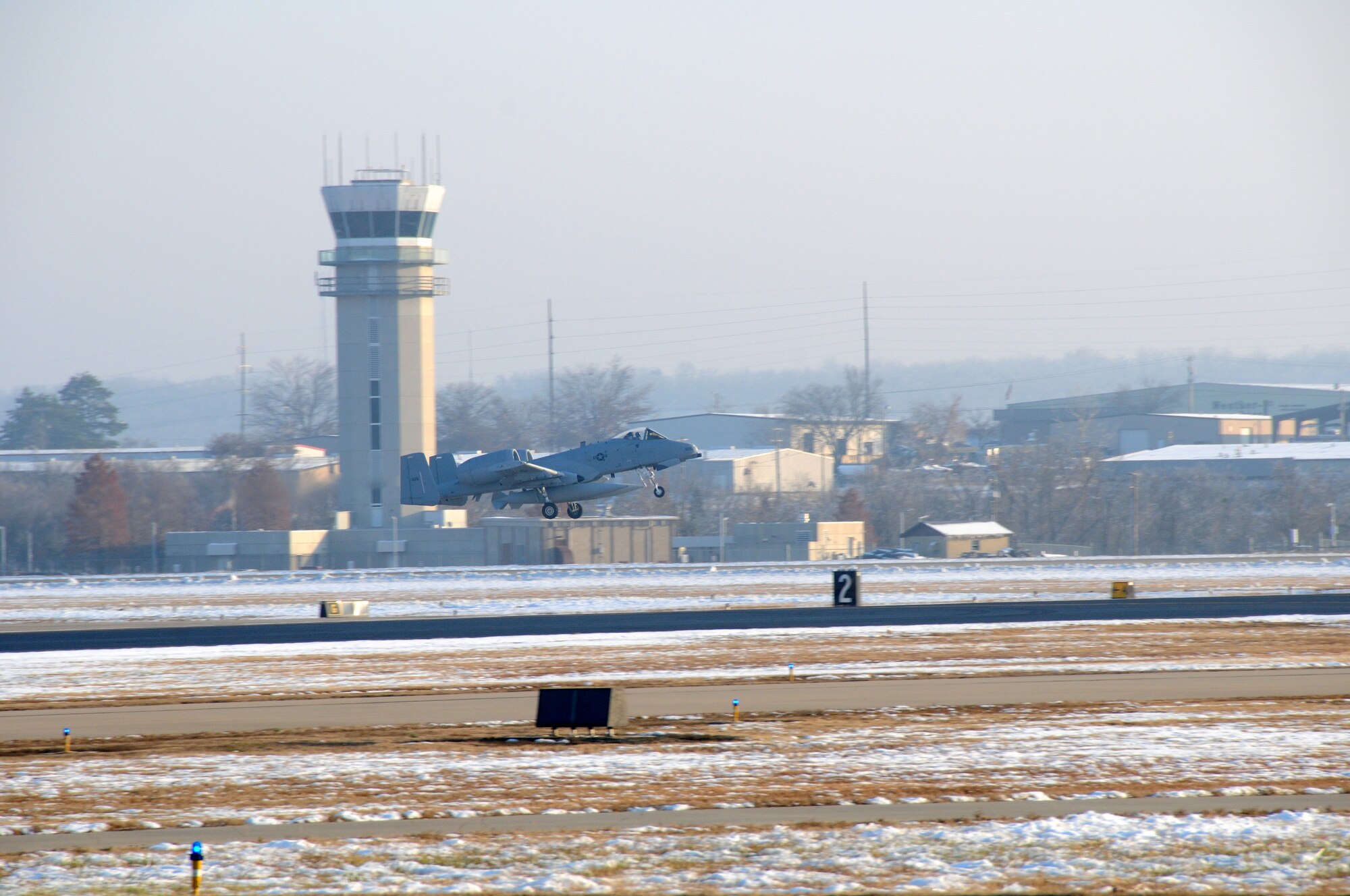 Lt. Col. Rob Myer, a pilot with the Indiana Air National Guard's 122nd Fighter Wing, takes off from Fort Smith, Ark., Dec. 11, 2013, delivering an A-10C Thunderbolt II "Warthog" from the 188th Fighter Wing to the 122nd. Tail Nos. 659 and 626 are bound for Fort Wayne, Ind., as part of the 188th’s on-going conversion from a fighter mission to remotely piloted aircraft and Intelligence mission, which will include a space-focused targeting squadron. (U.S. Air National Guard photo by Senior Airman John Hillier/188th Fighter Wing Public Affairs)