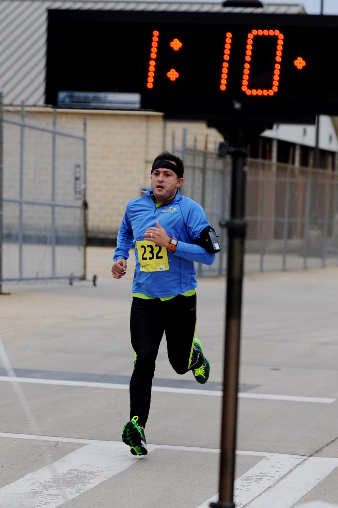 Emilio Garcia runs toward the finish line during the 4th annual “Race ‘Round the Base” at Langley Air Force Base, Va., Dec. 14, 2013. The 10-mile race took runners on a tour around and through the base. (U.S. Air Force photo by Staff Sgt. Jarad A. Denton/Released)