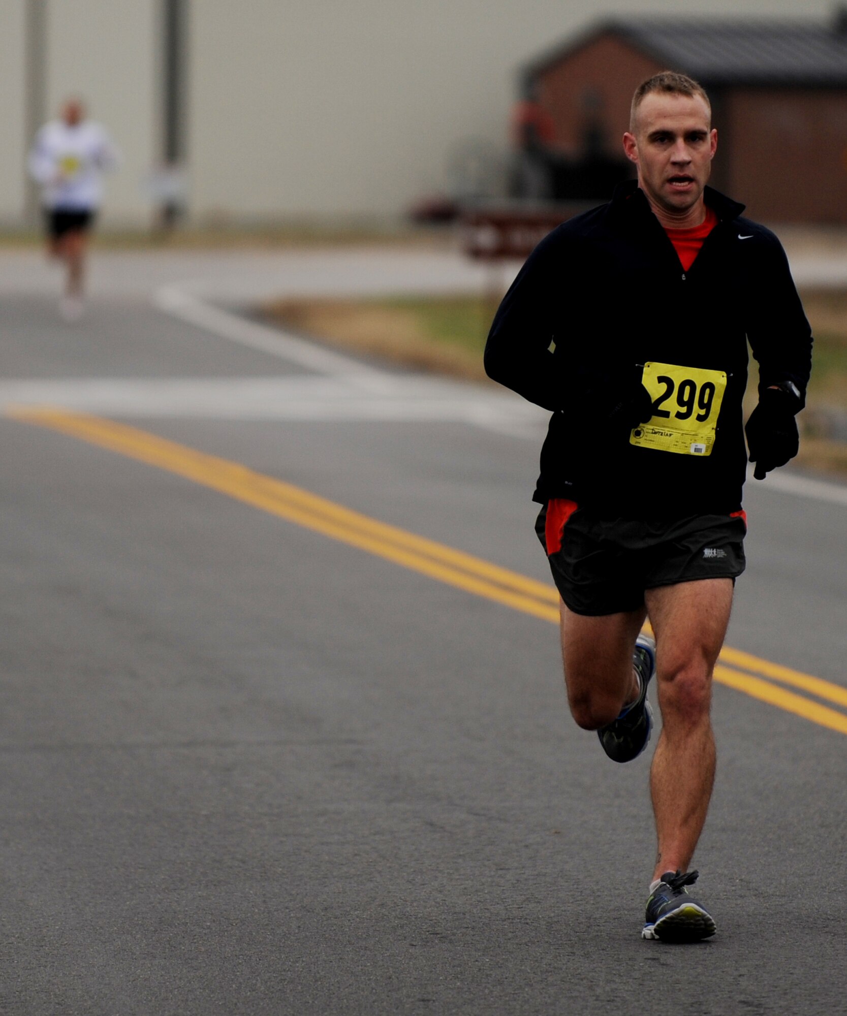 U.S. Air Force Capt. Ross Dotzlaf, Air Combat Command Installations and Missions Support Directorate executive officer, runs during the 4th annual “Race ‘Round the Base,” at Langley Air Force Base, Va., Dec. 14, 2013. This 10-mile race is the longest running event hosted at Langley. (U.S. Air Force photo by Staff Sgt. Jarad A. Denton/Released)