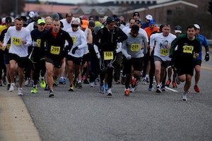 Participants run during the 4th annual “Race ‘Round the Base” at Langley Air Force Base, Va., Dec. 14, 2013. The 10-mile race took participants on a loop around and through portions of Langley. (U.S. Air Force photo by Staff Sgt. Jarad A. Denton/Released)