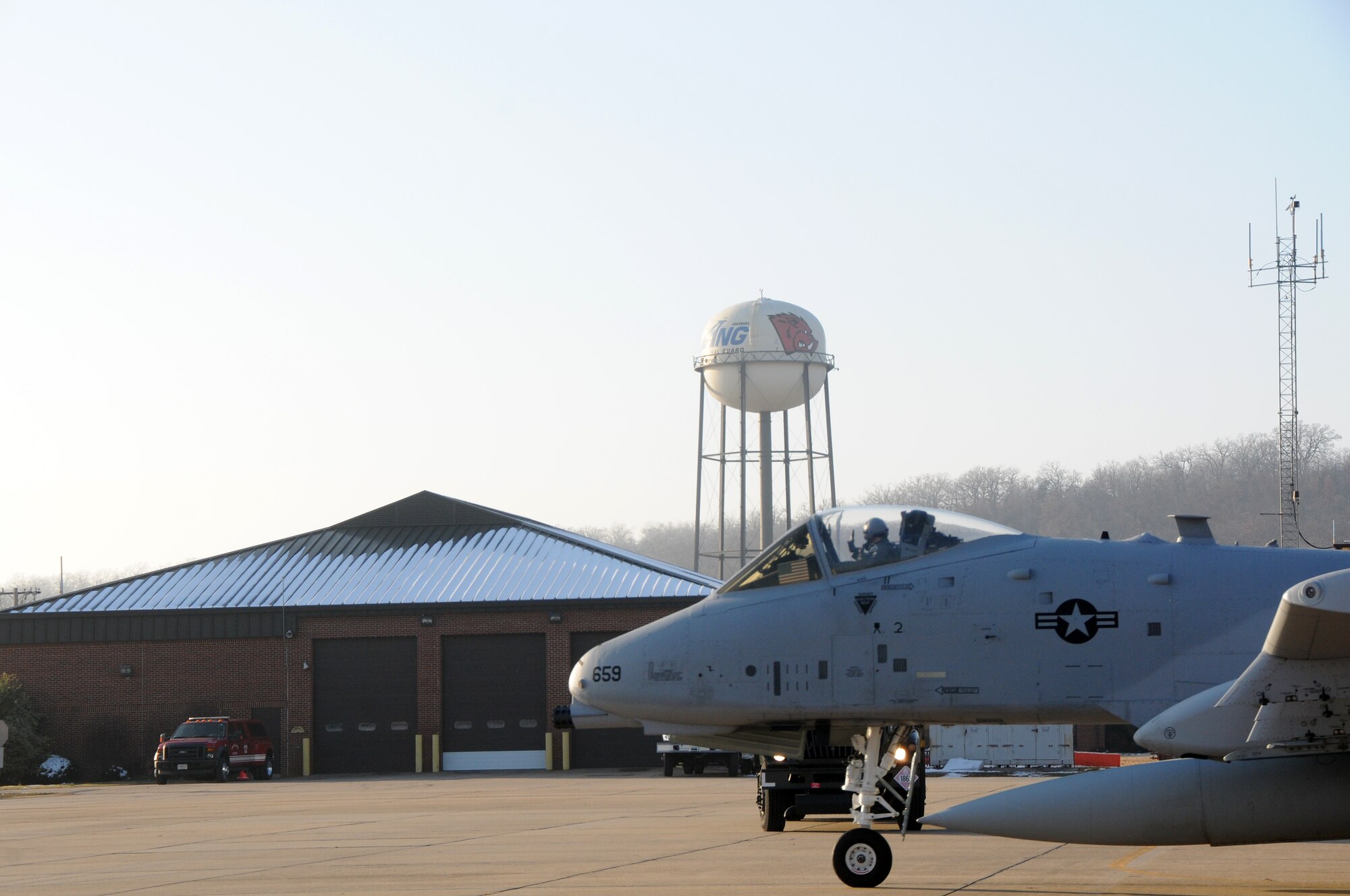Col. Michael Stohler, a pilot with the Indiana Air National Guard's 122nd Fighter Wing, taxis at Ebbing Air National Guard Base, Fort Smith, Ark., Dec. 11, 2013, preparing to deliver an A-10C Thunderbolt II "Warthog" from the 188th Fighter Wing to the 122nd. Tail Nos. 659 and 626 are bound for Fort Wayne, Ind., as part of the 188th’s on-going conversion from a fighter mission to remotely piloted aircraft and Intelligence mission, which will include a space-focused targeting squadron. (U.S. Air National Guard photo by Senior Airman John Hillier/188th Fighter Wing Public Affairs)