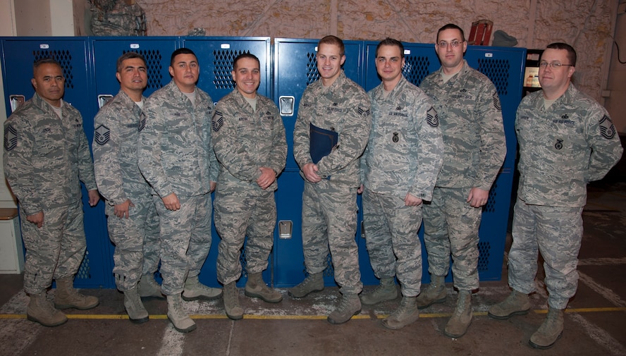 Senior Airman Matthew LoManaco, 91st Tactical Response Force, receives an award by the Minot Top 3 for his excellence in performing day to day operations here, Dec. 6, 2013. LoManaco’s display of his professionalism and excellence was evident in his day to day work ethic. (U.S. Air Force photo/Airman 1st Class Andrew Crawford)