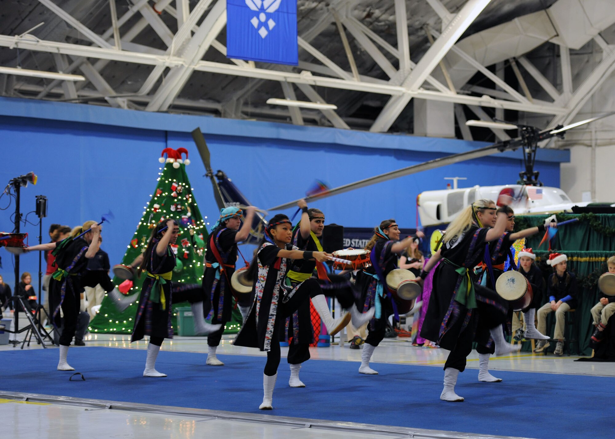 The Chin Hamaya Culture Center dancers give an energetic performance and are one of many groups who volunteered at the 26th Annual Parents and Children Fighting Cancer Christmas Party on Dec. 14, 2013 in Hangar 3 on Joint Base Andrews, Md. This event allowed PCFC families to spend the day in a winter wonderland offering food, entertainment, gifts, static displays, and a visit from Santa and Mrs. Claus. (U.S. Air Force photo/Aimee Fujikawa)

